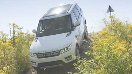Range Rover driving down a hill