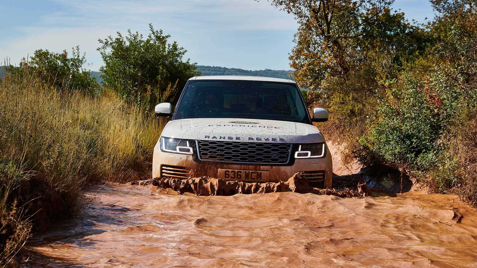Land Rover Vehicle driving through deep water