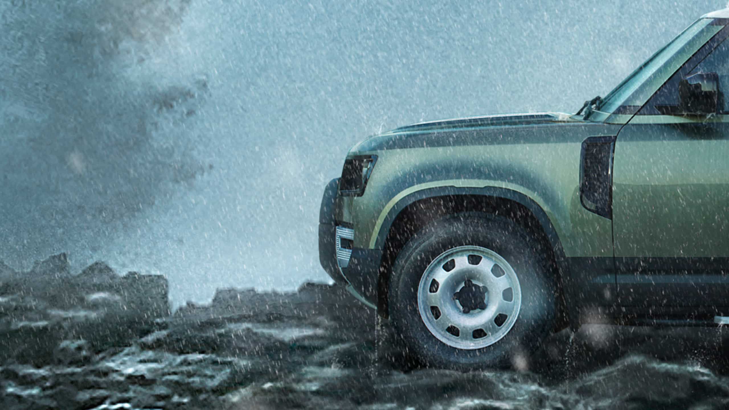 Defender on Mountain surrounded with water