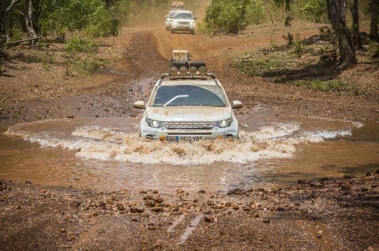 Range Rover driving through mud
